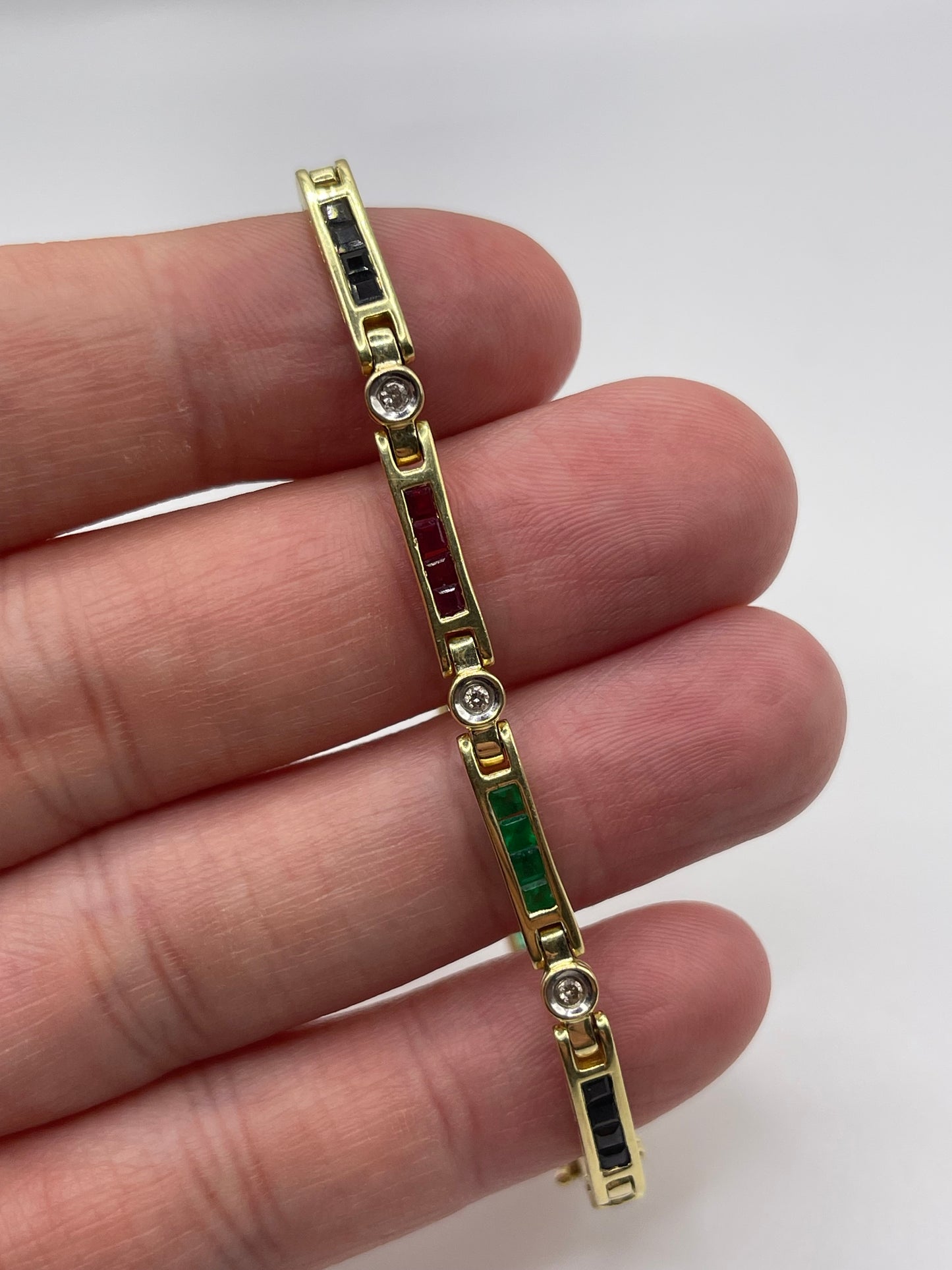 14ct gold ruby, sapphire, emerald and diamond bracelet