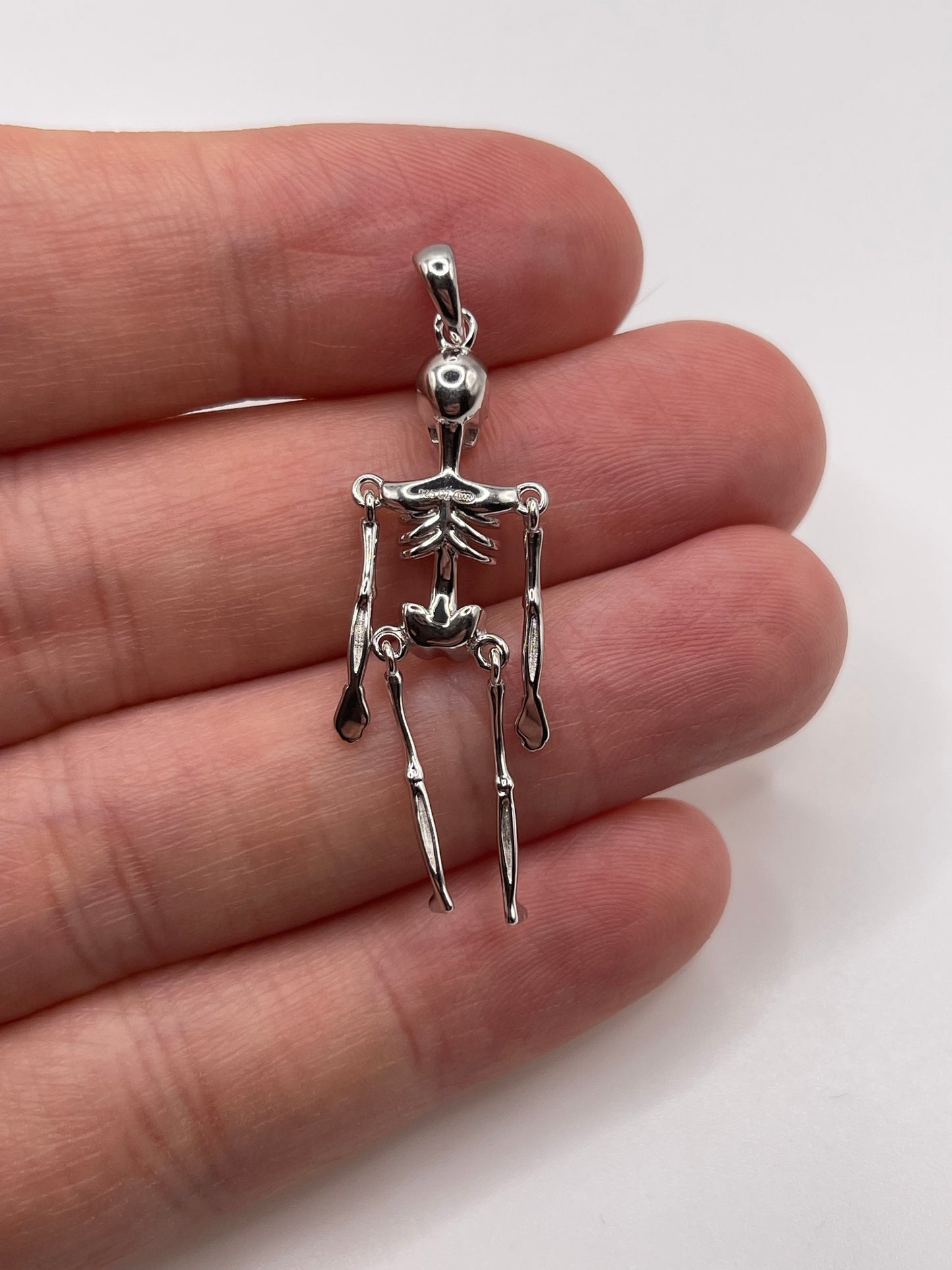 Silver articulated skeleton pendant