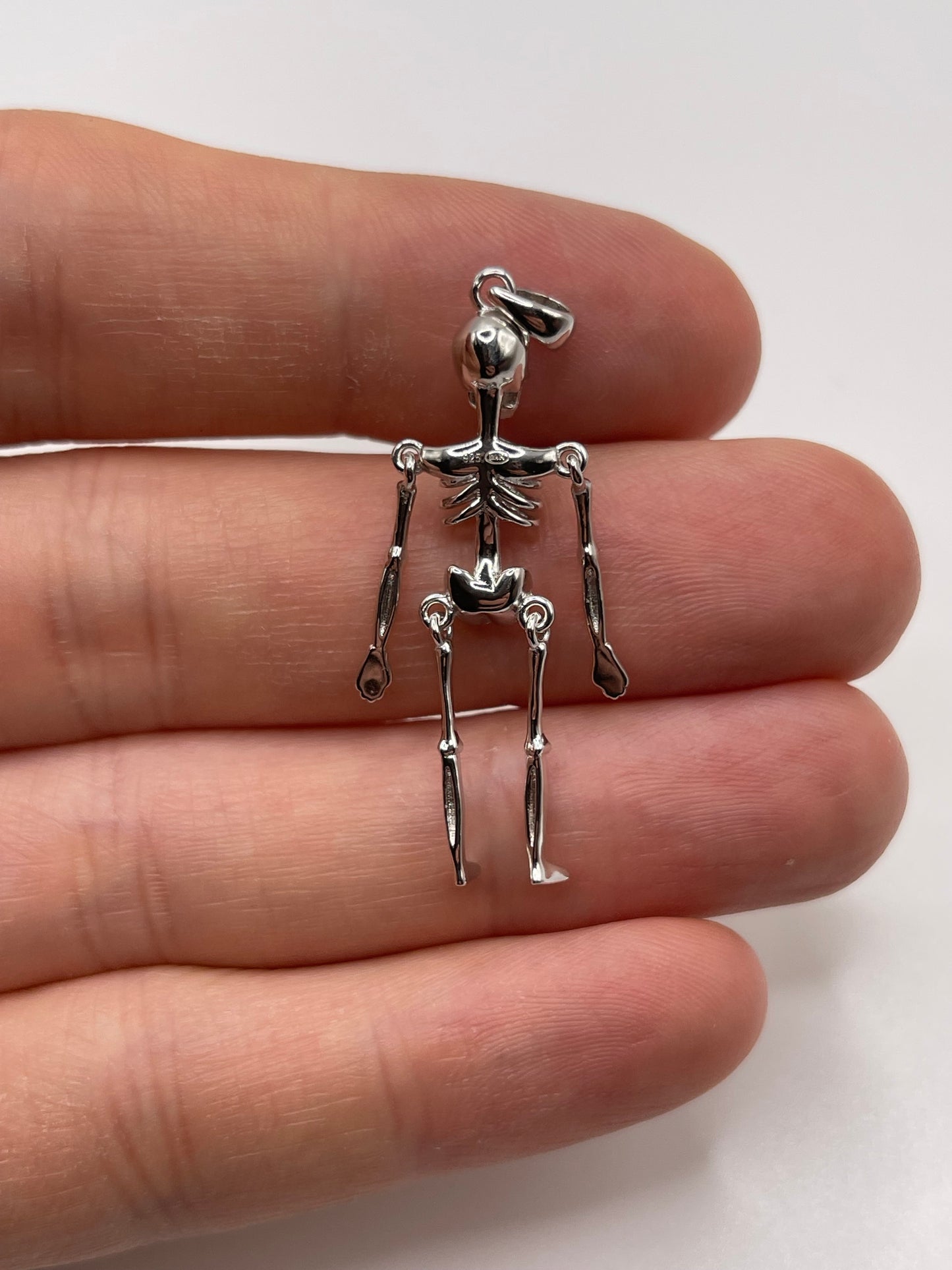 Silver articulated skeleton pendant