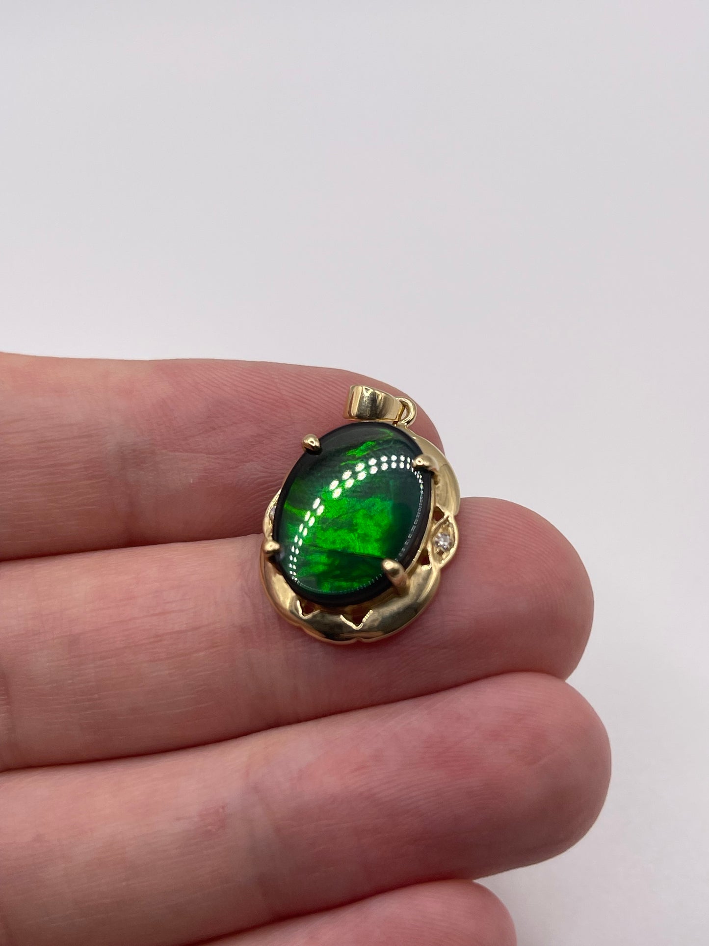 14ct gold ammolite and diamond pendant