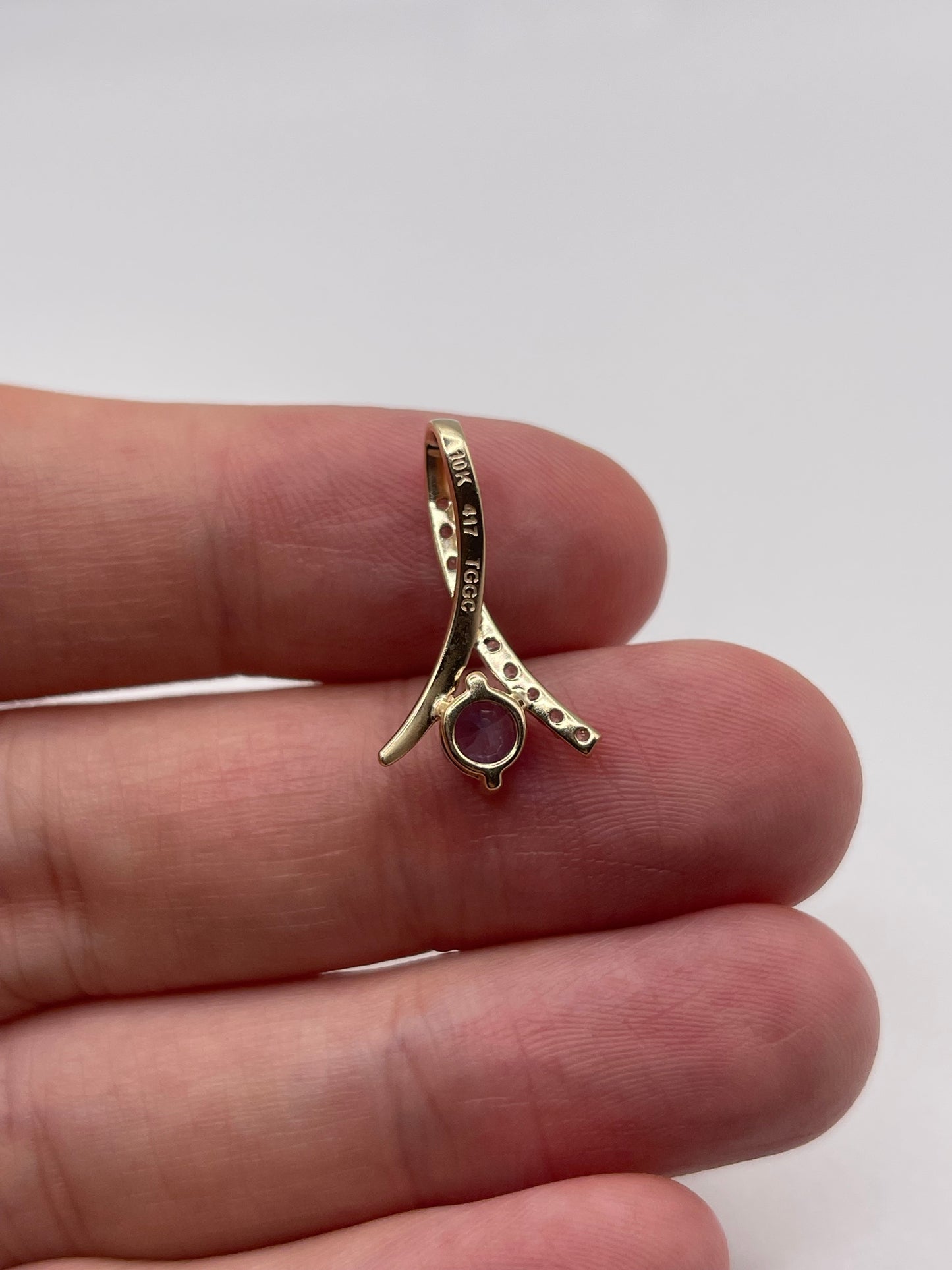 9ct gold tanzanite and zircon pendant