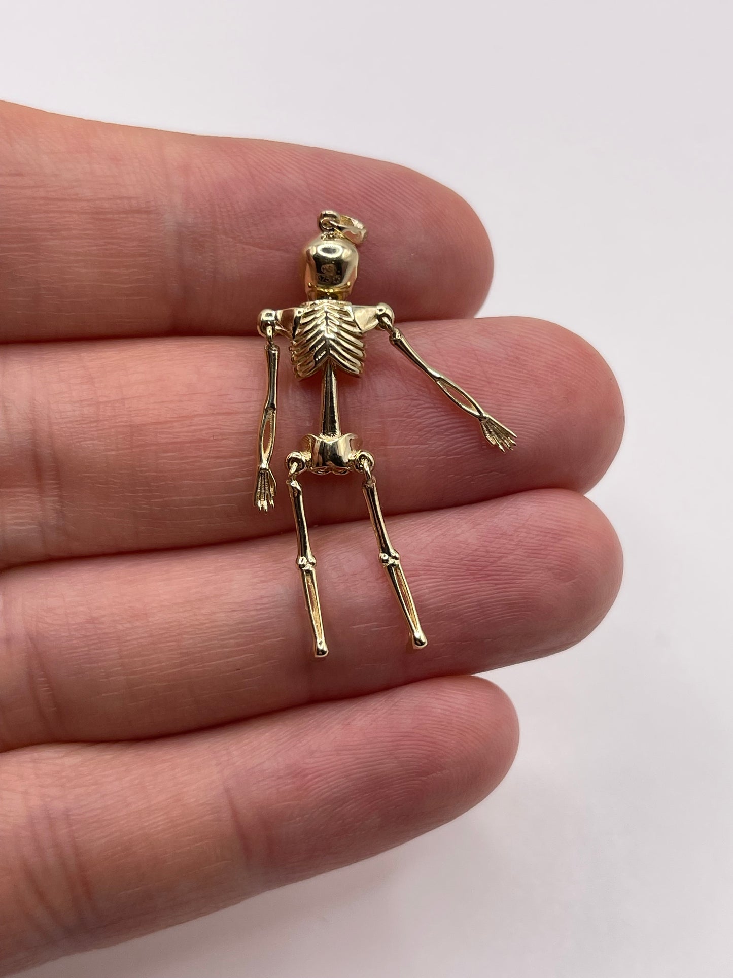 9ct gold articulated skeleton pendant