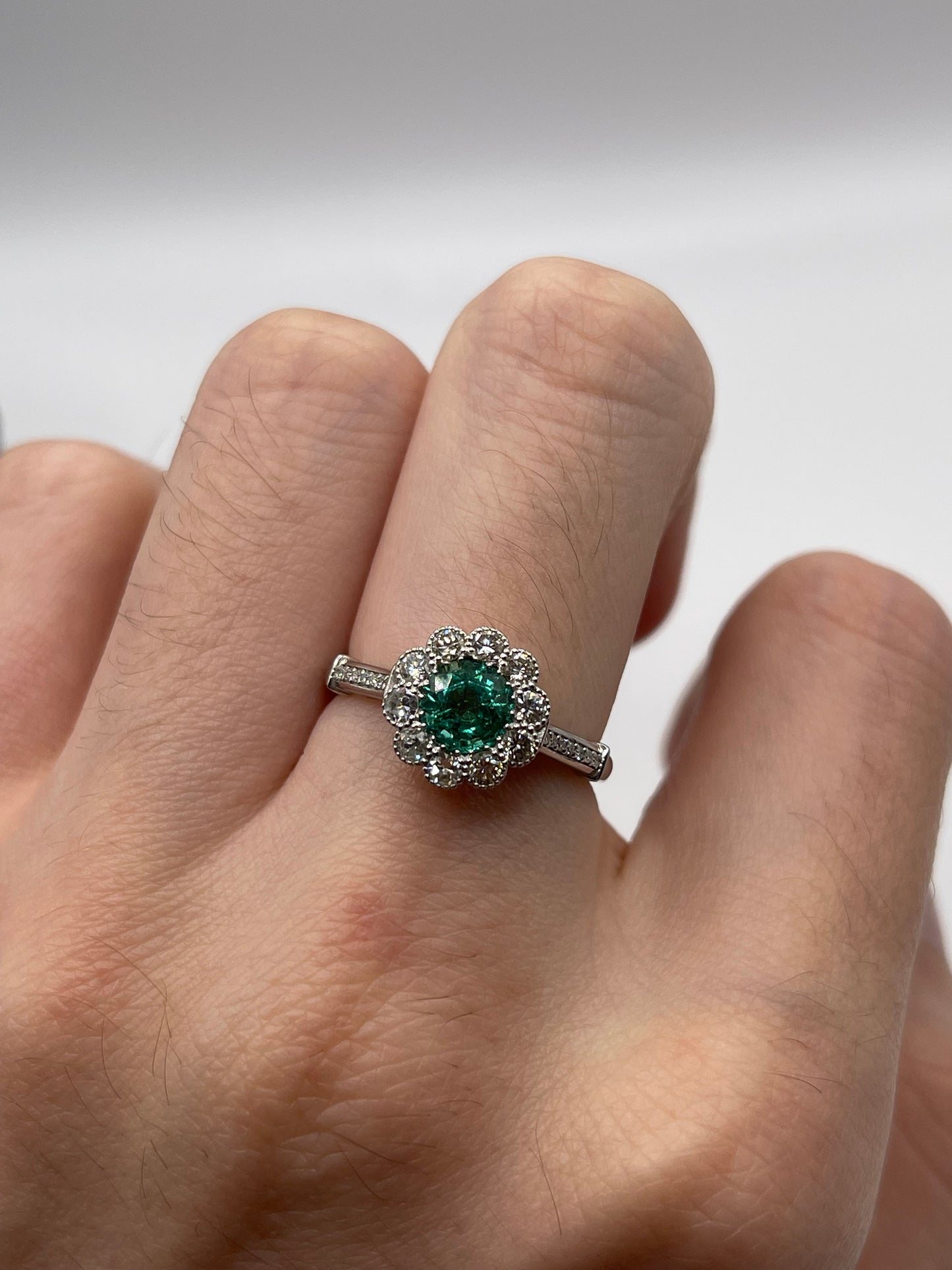 Platinum emerald and diamond ring