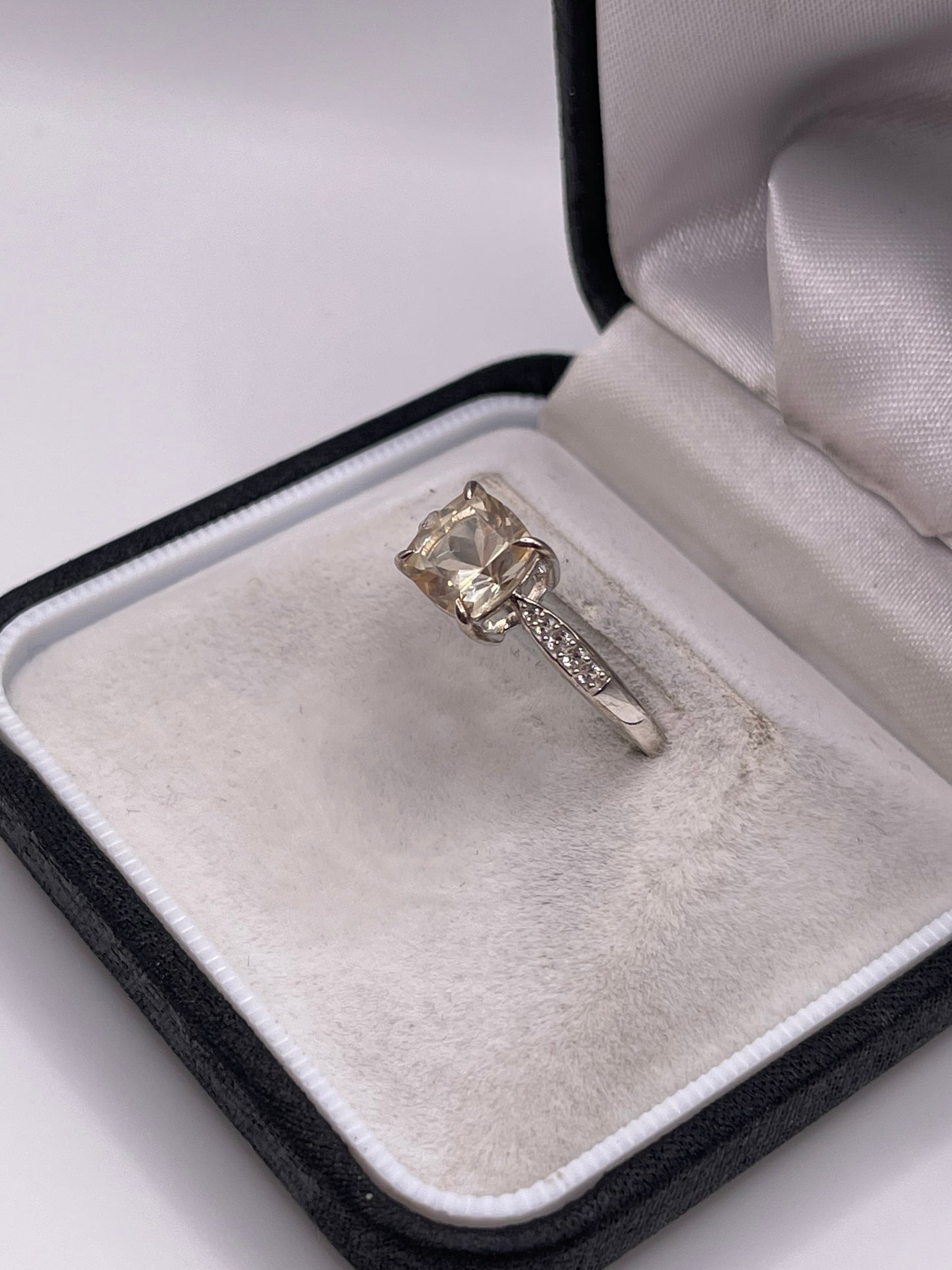 Silver topaz and zircon ring