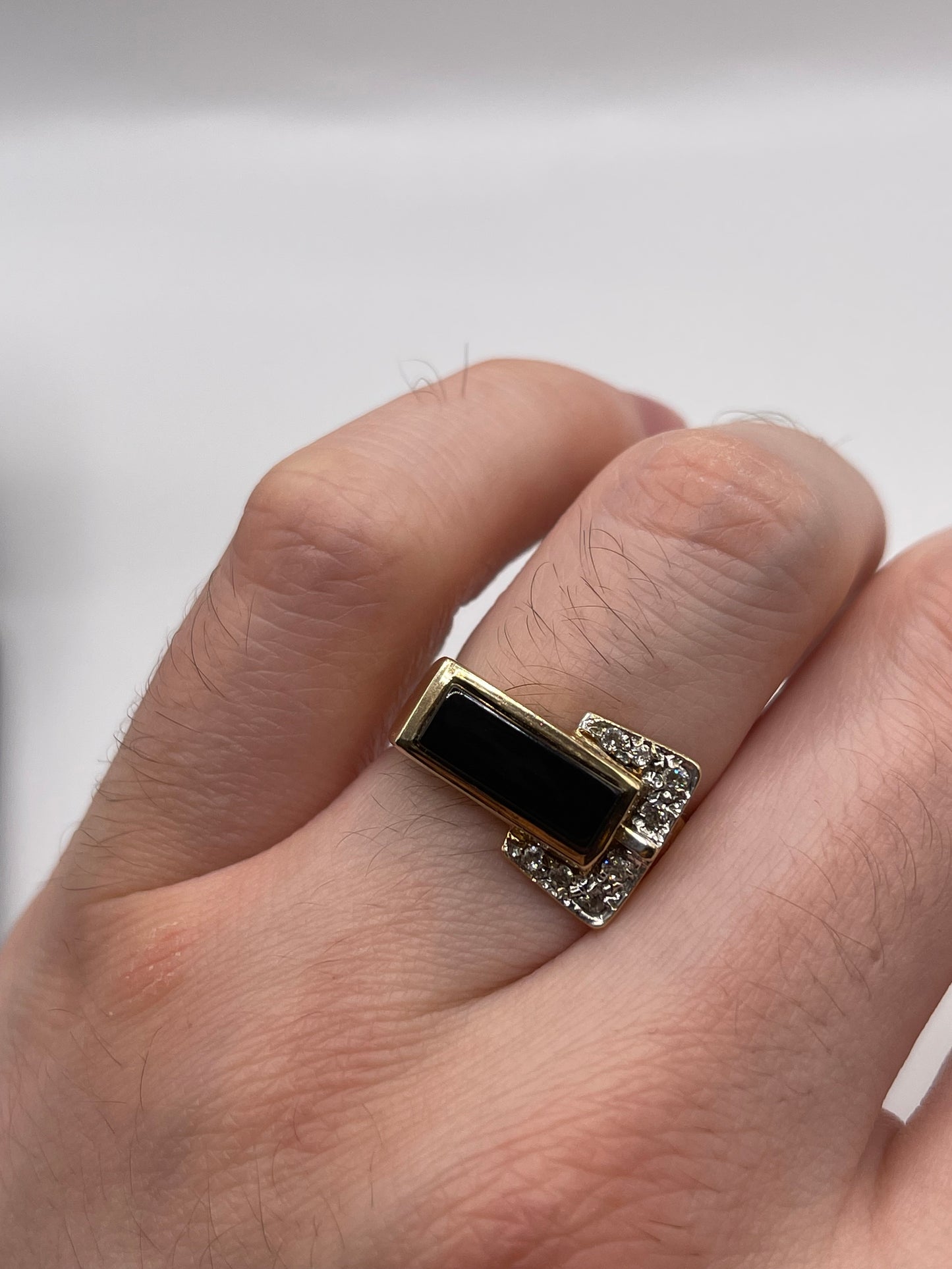 9ct gold onyx and diamond buckle ring