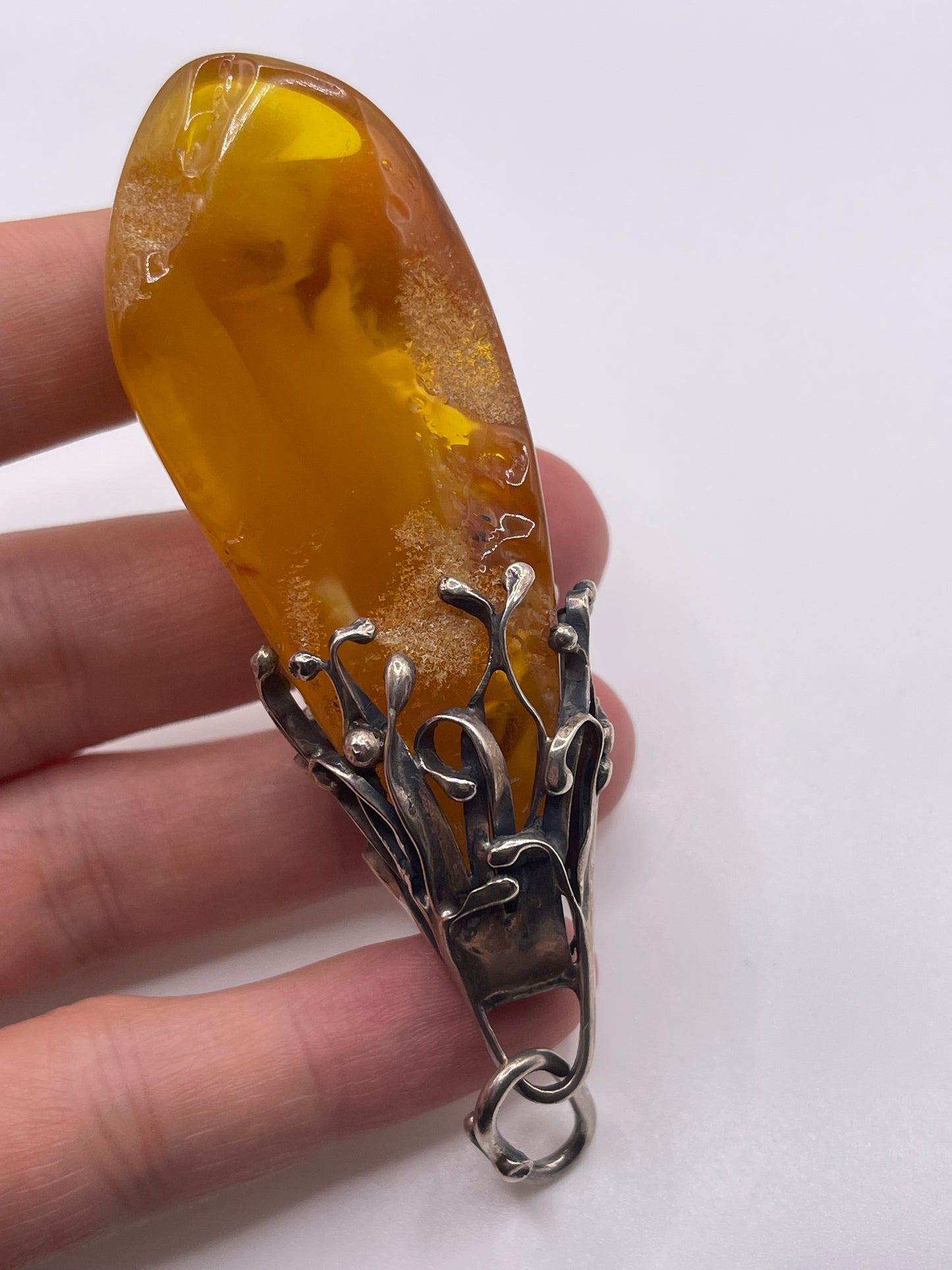 Silver amber pendant