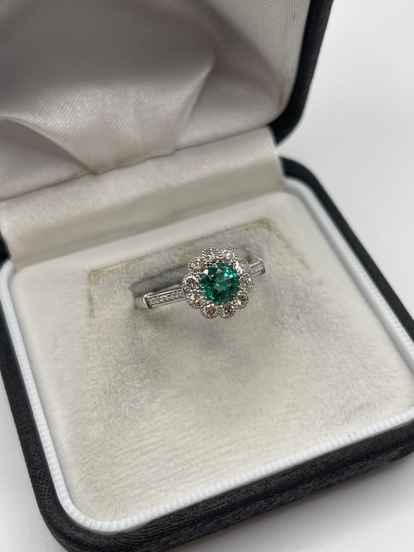 Platinum emerald and diamond ring