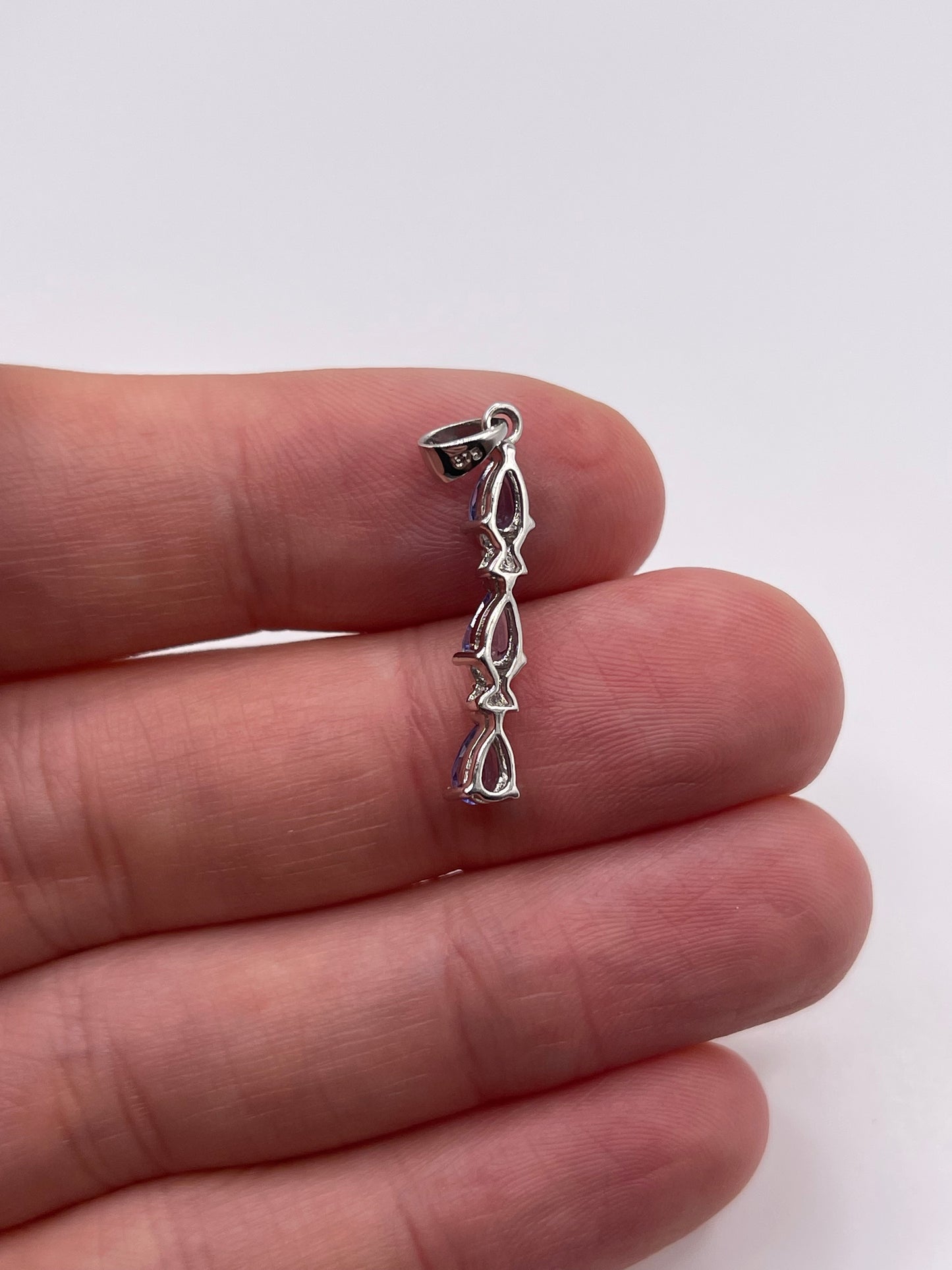 9ct white gold tanzanite and diamond pendant