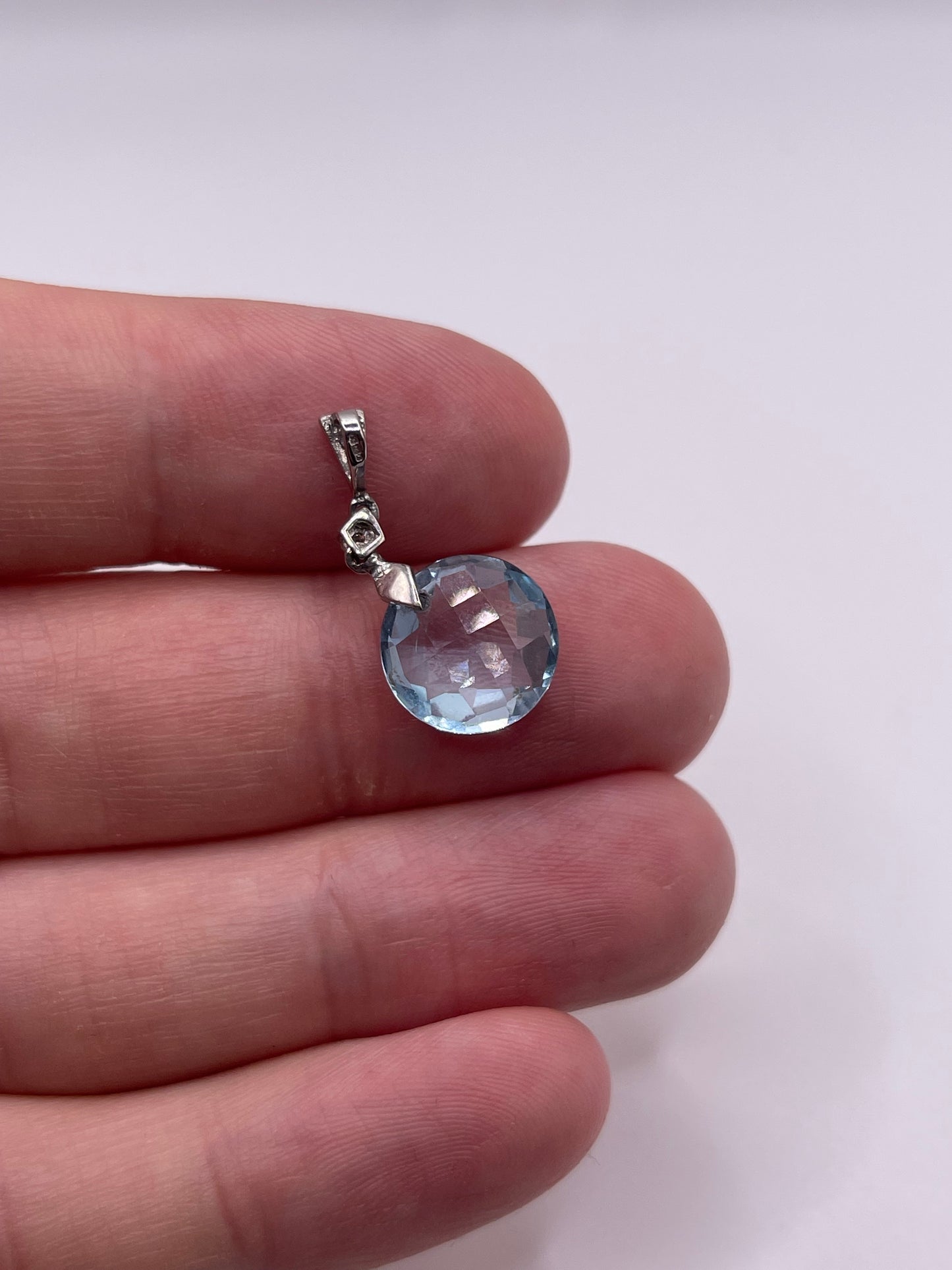 9ct white gold topaz and diamond pendant
