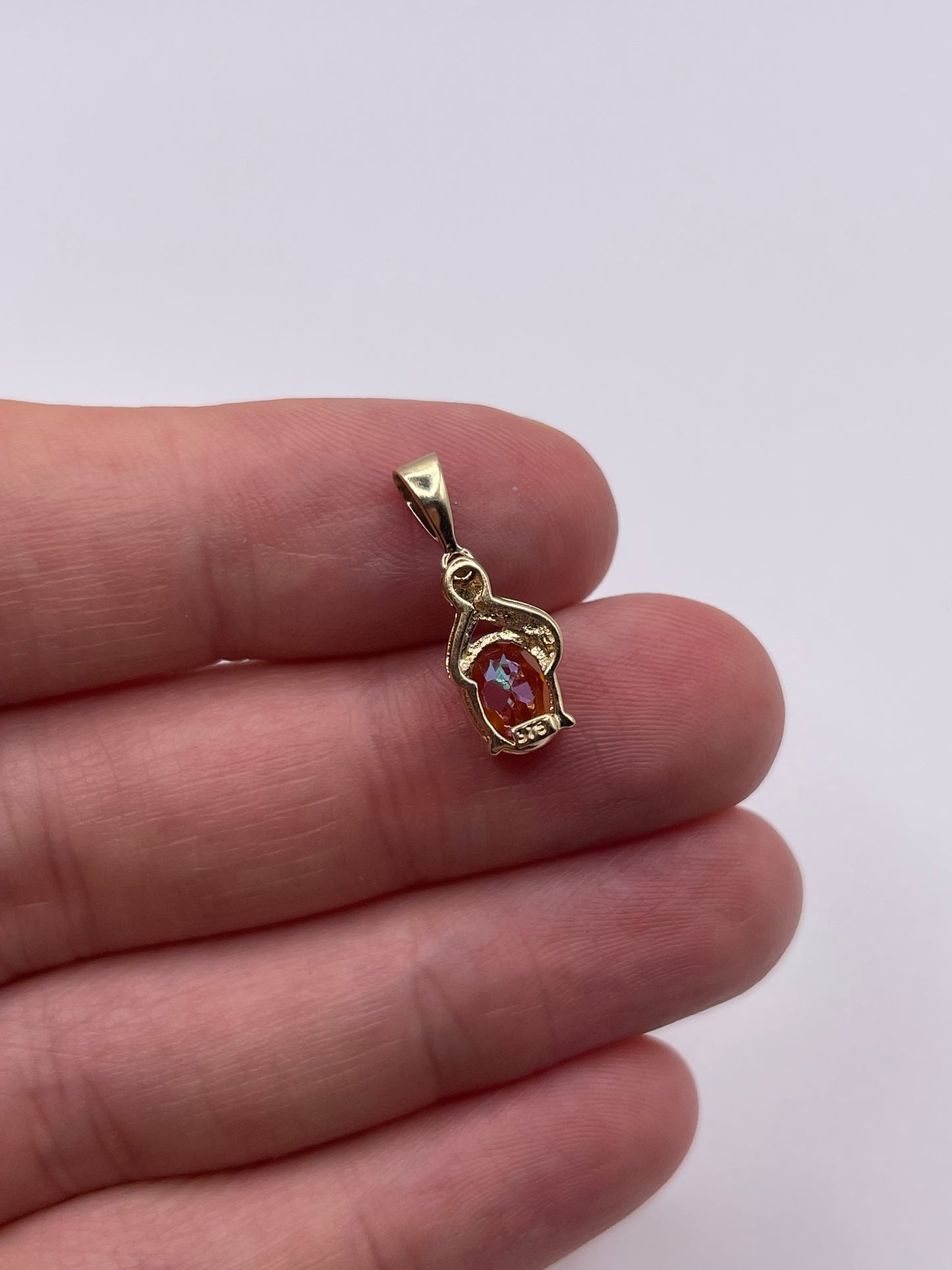 9ct gold topaz and diamond pendant