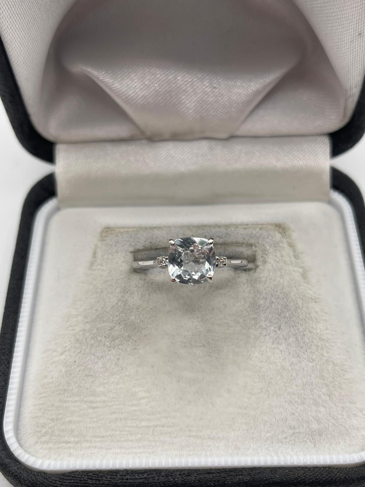 14ct white gold topaz and diamond ring
