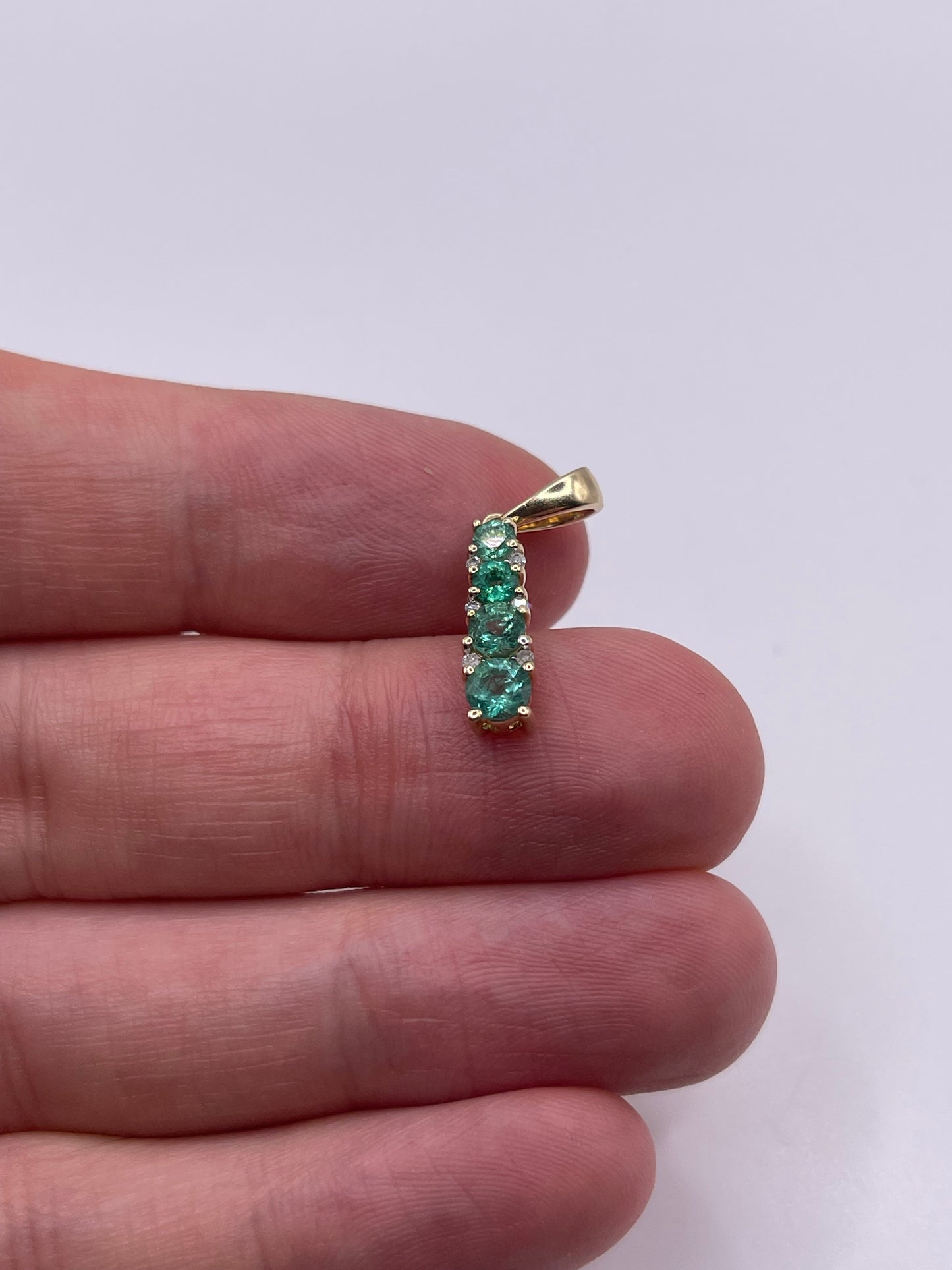 9ct gold emerald and diamond pendant