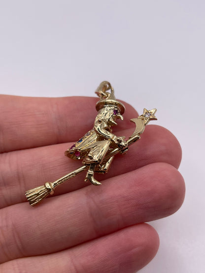 9ct gold stone set articulated witch pendant