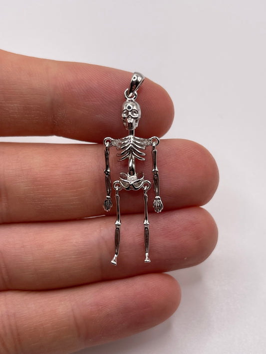 Silver articulated skeleton pendant