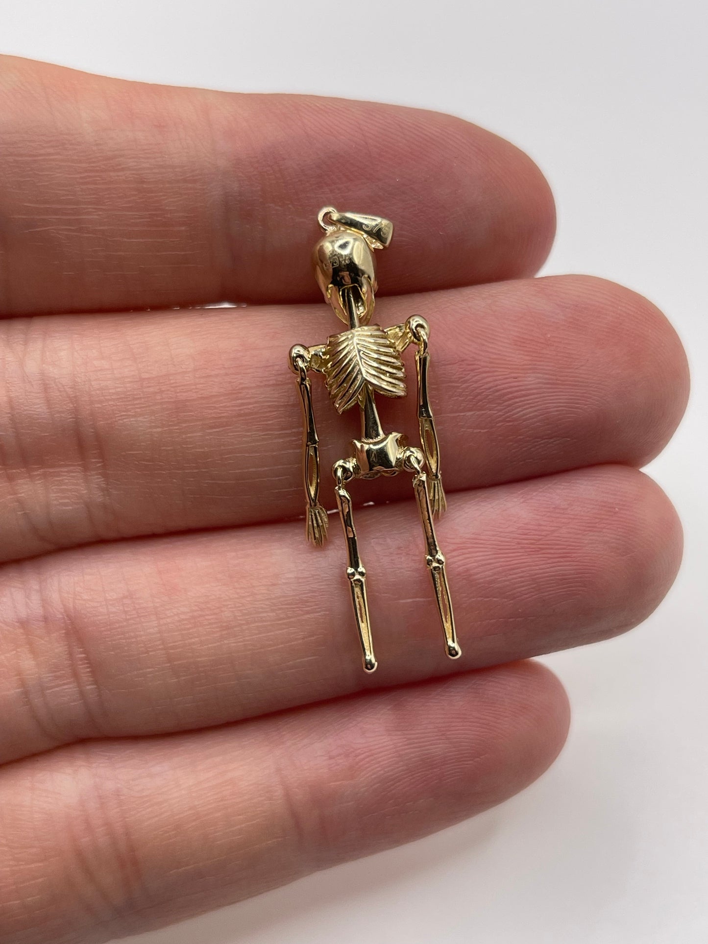 9ct gold articulated skeleton pendant