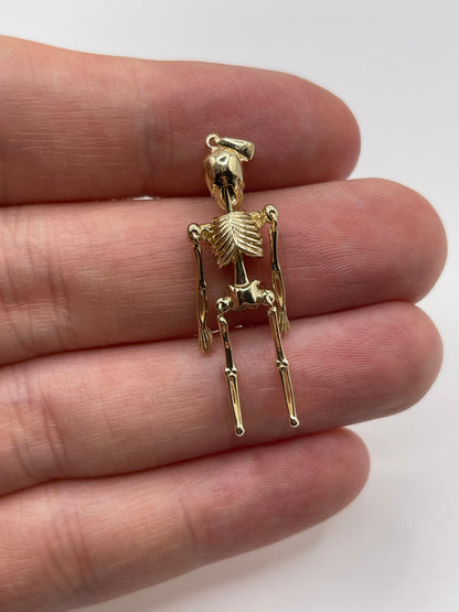 9ct gold articulated skeleton pendant