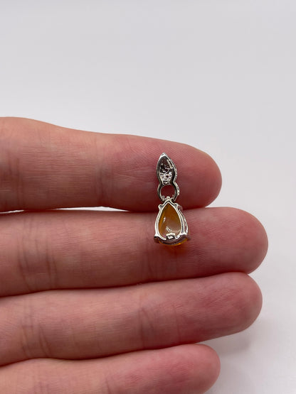 9ct white gold opal and diamond pendant