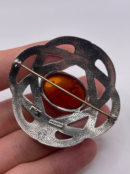 Silver amber brooch