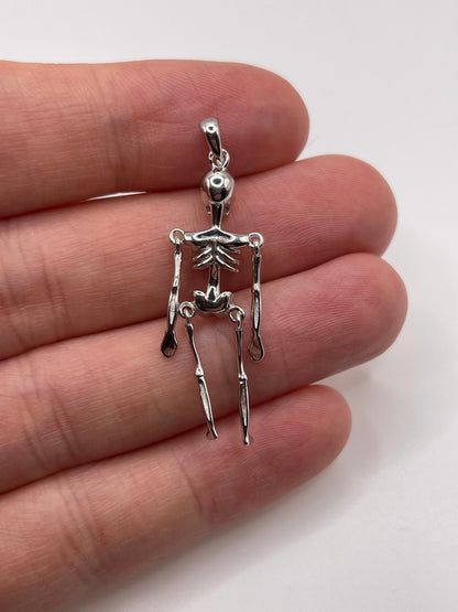 Silver articulated skeleton pendant