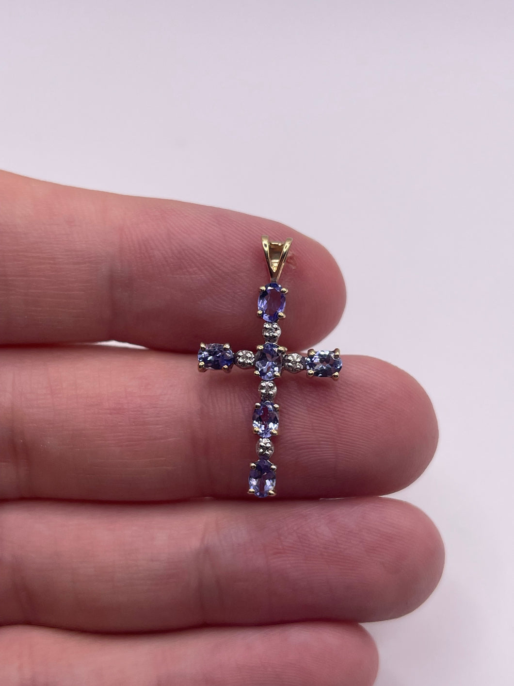 9ct gold tanzanite and diamond cross pendant