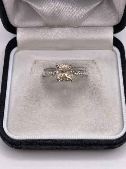 Silver topaz and zircon ring