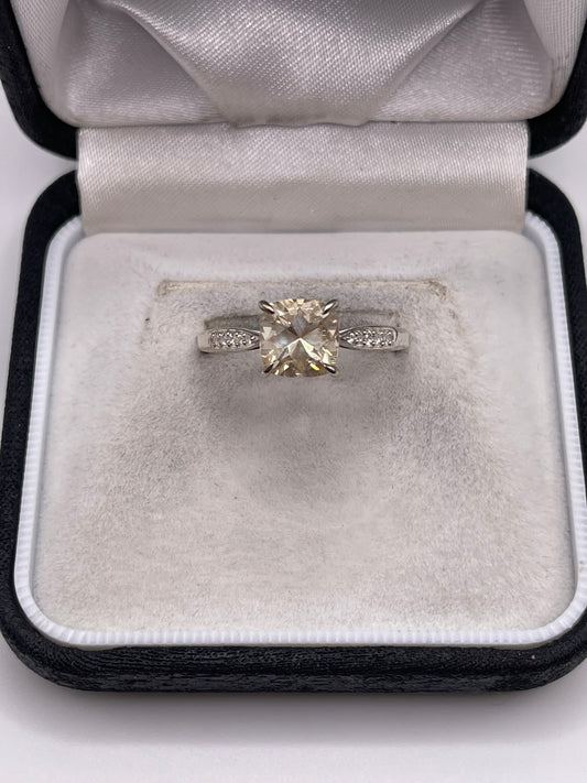 Silver topaz and zircon ring