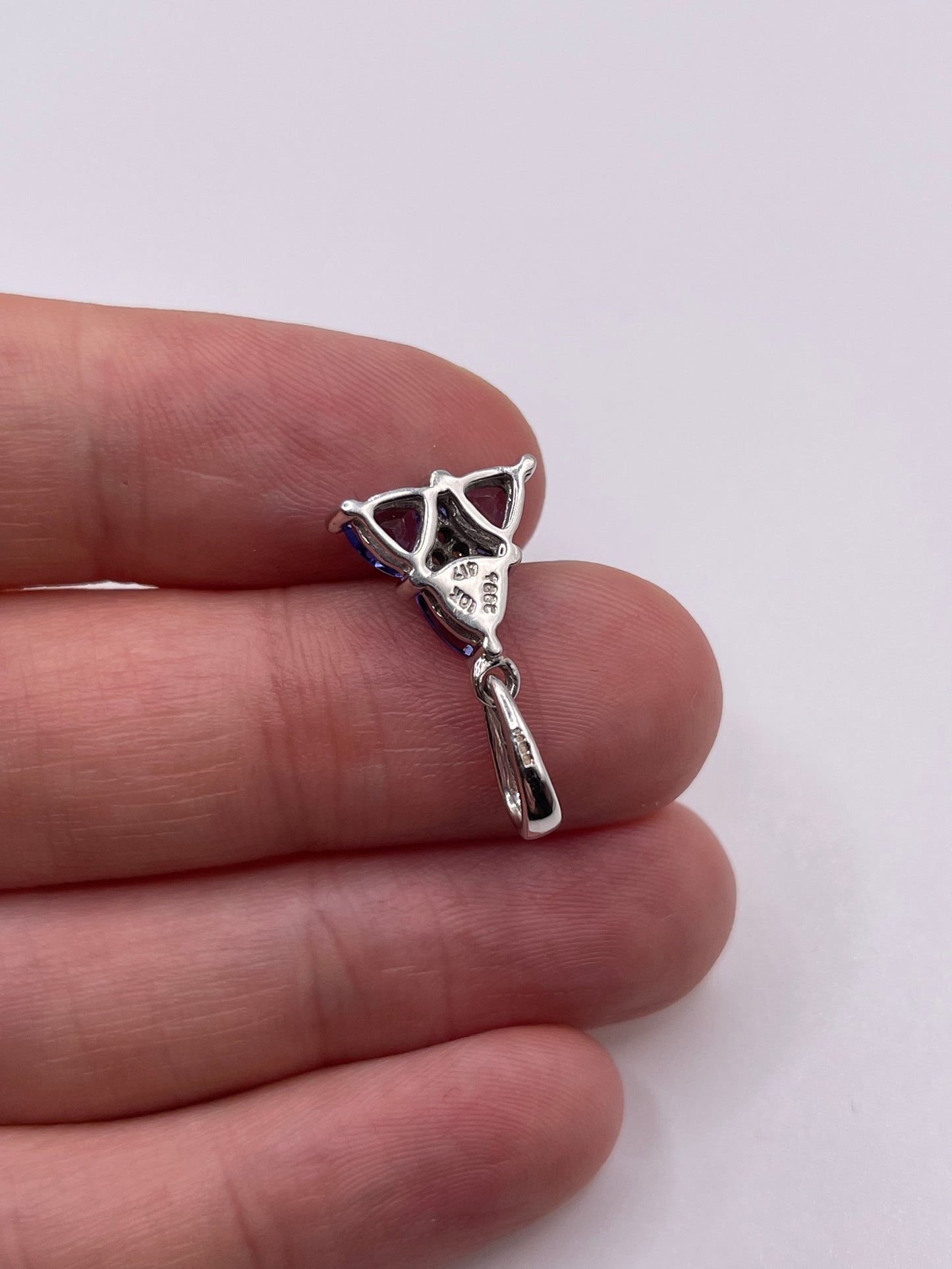 9ct white gold tanzanite and zircon pendant