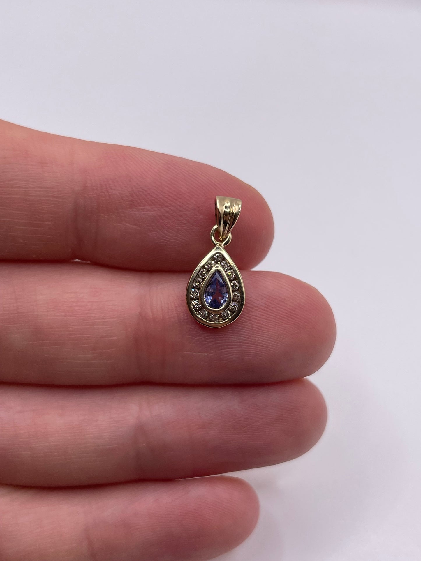 9ct gold tanzanite and diamond pendant