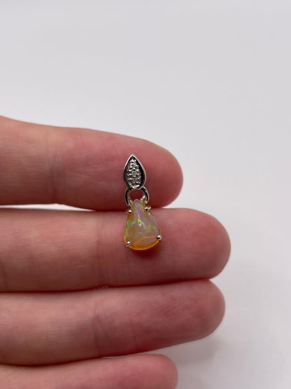 9ct white gold opal and diamond pendant