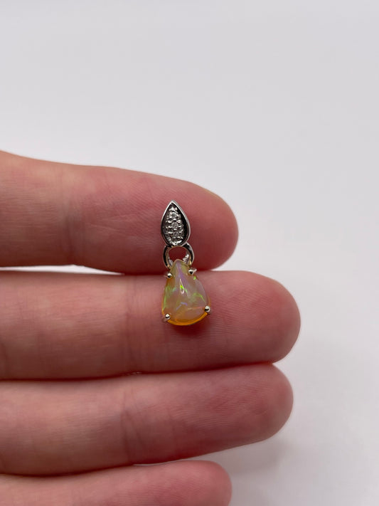 9ct white gold opal and diamond pendant