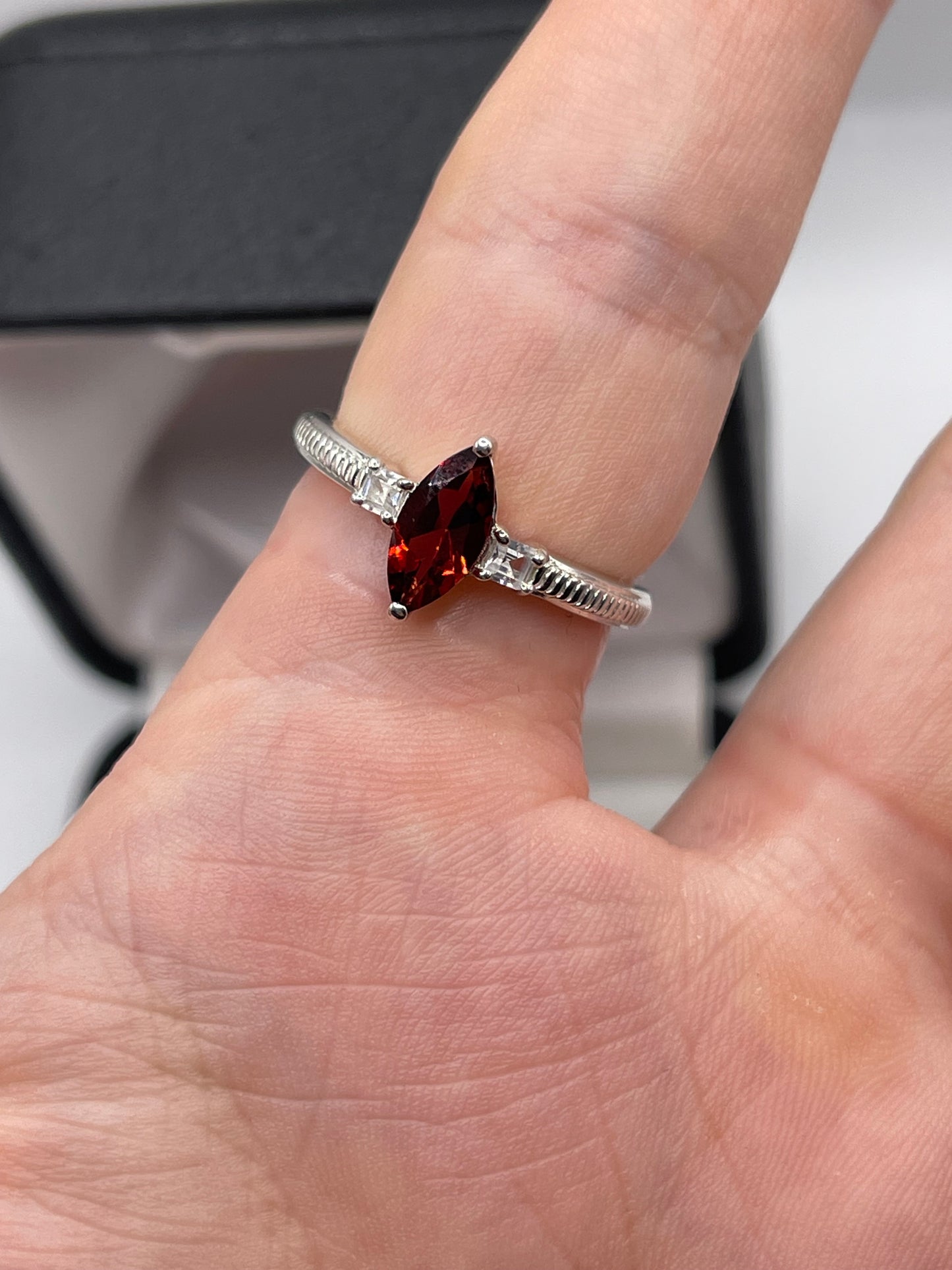 Silver garnet and zircon ring
