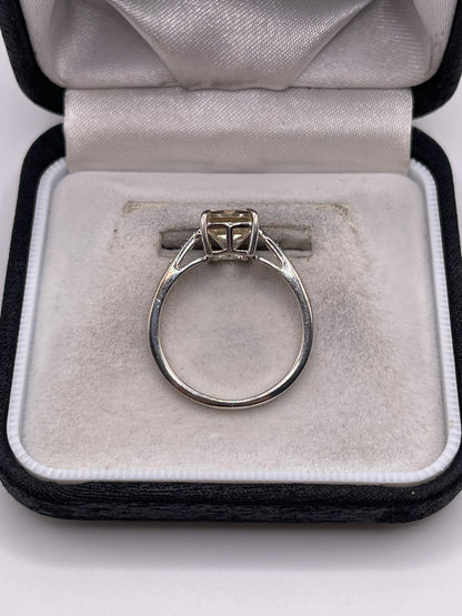 Silver topaz and zircon ring