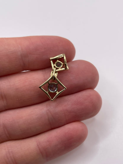 9ct gold blue zircon and diamond pendant