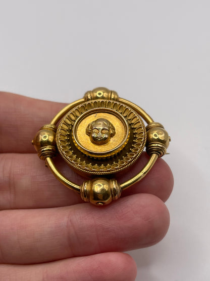 Antique 18ct gold cherub brooch