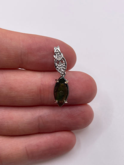 9ct white gold Ammolite and zircon pendant