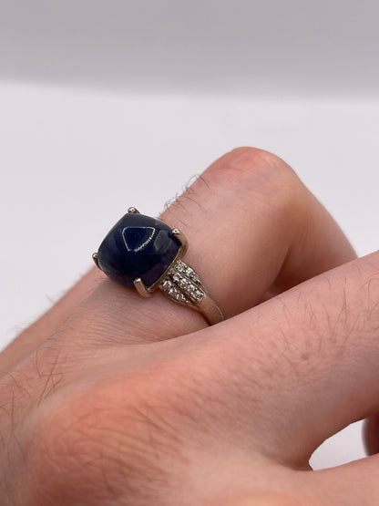 Silver cabochon sapphire and zircon ring