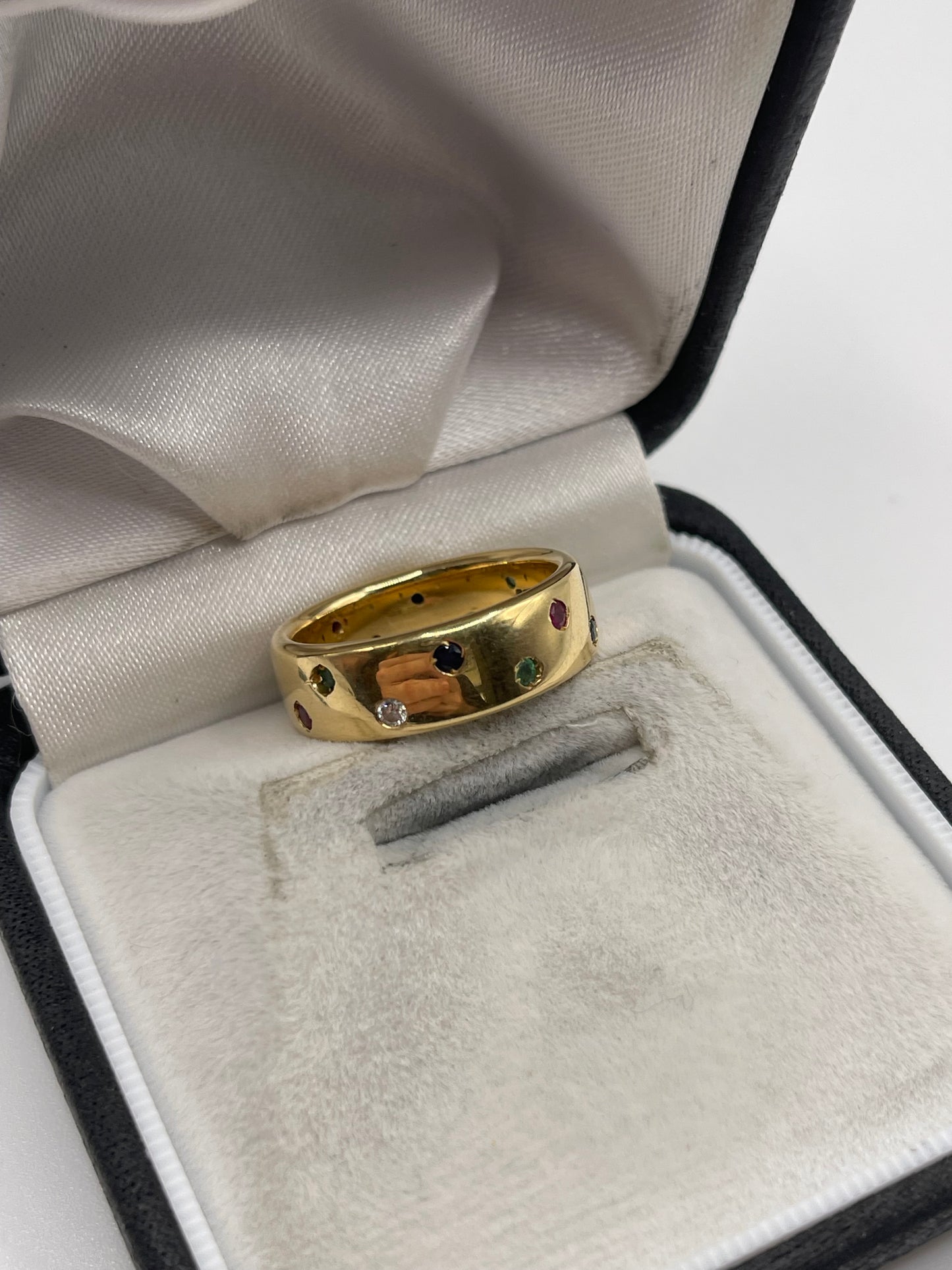 18ct gold ruby, emerald, sapphire and diamond eternity ring