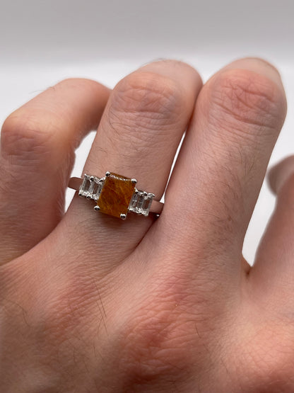 Silver rutile quartz and zircon ring