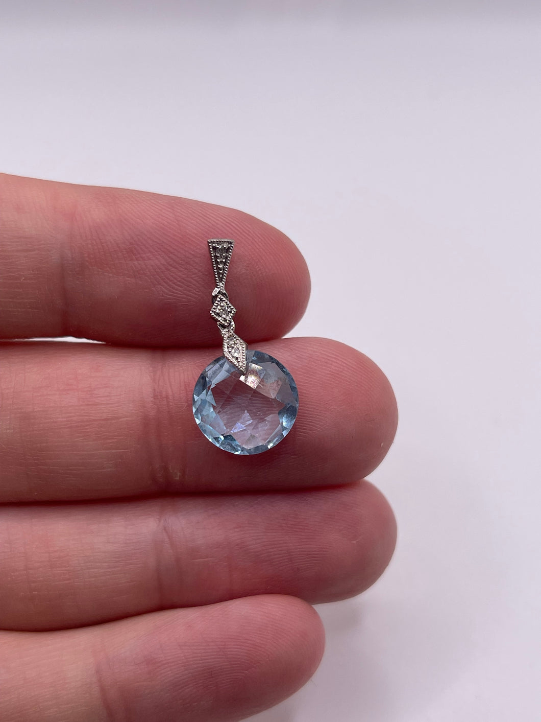 9ct white gold topaz and diamond pendant