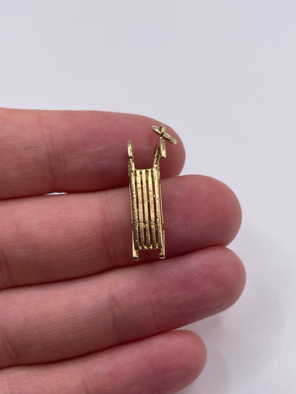 9ct gold sled charm