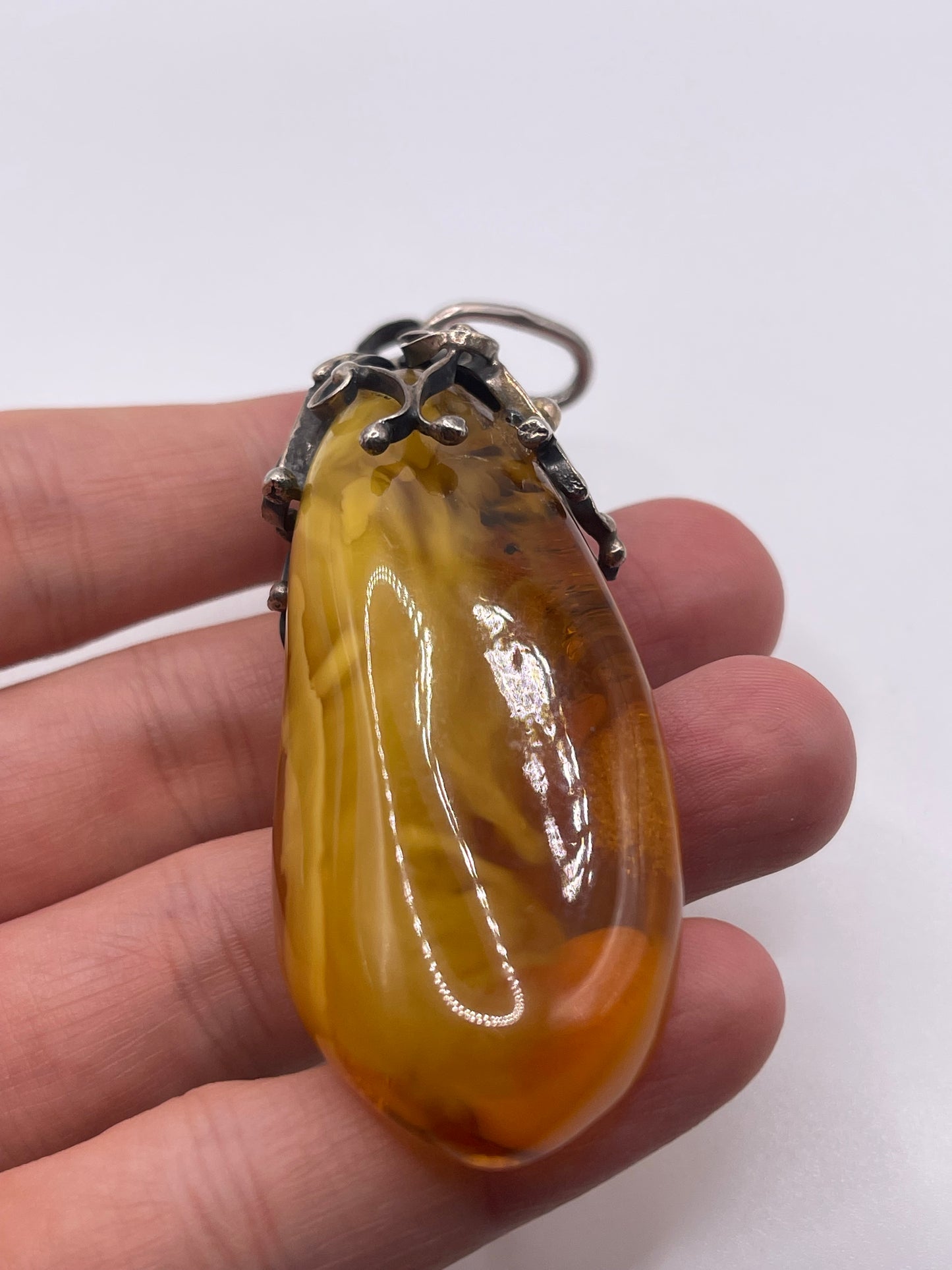 Silver amber pendant