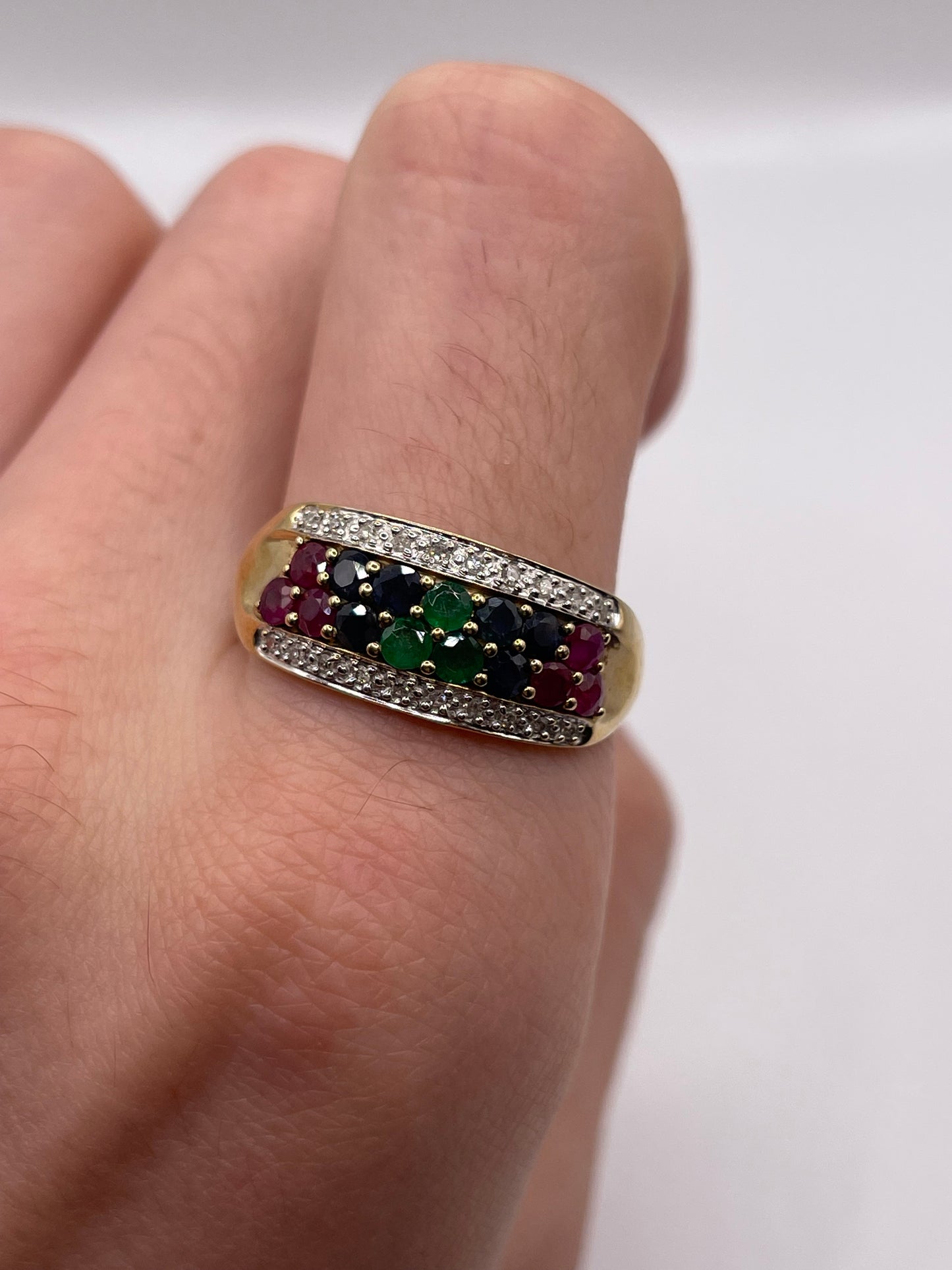 9ct gold emerald, sapphire, ruby and diamond ring