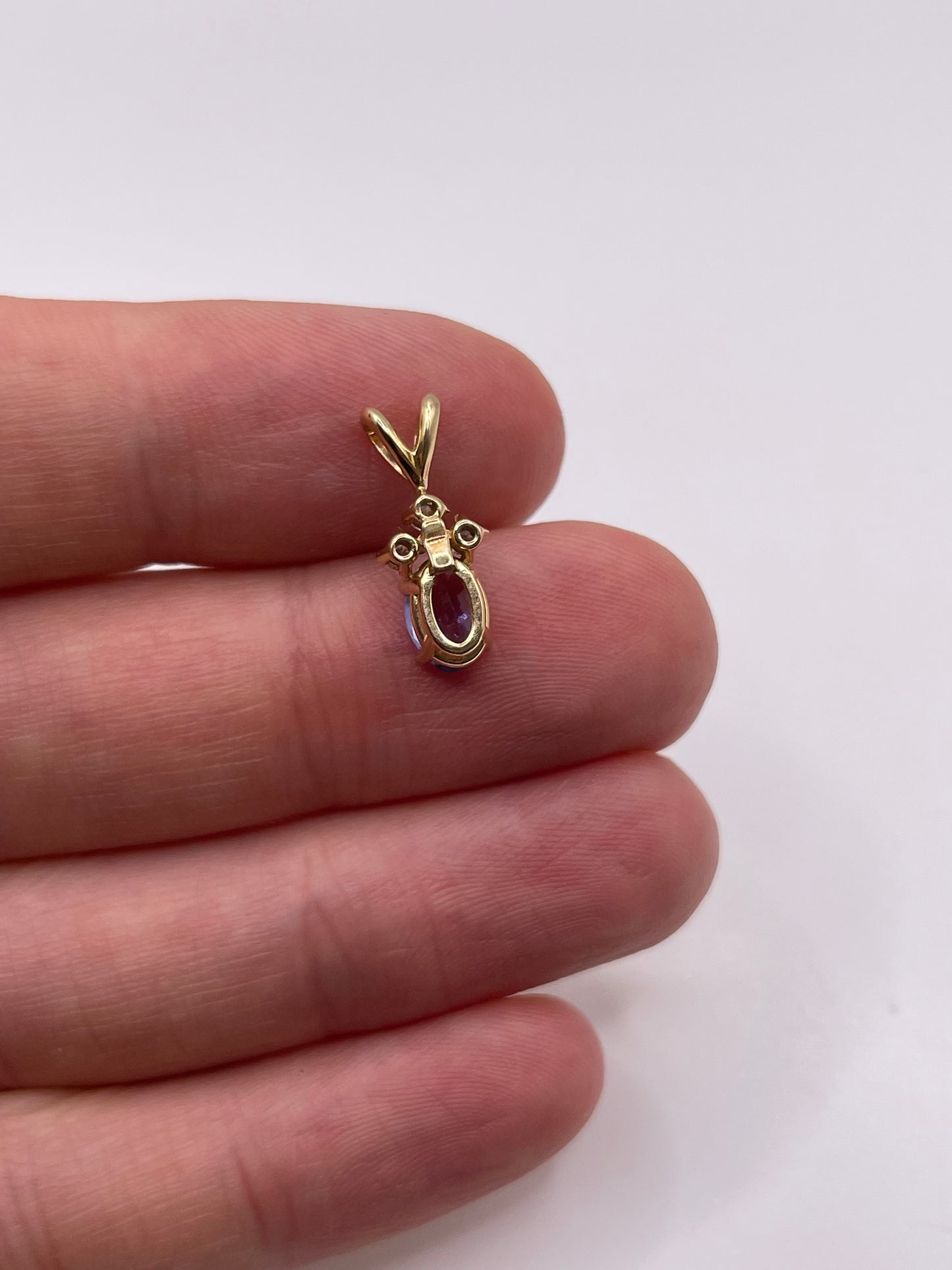 9ct gold tanzanite and diamond pendant