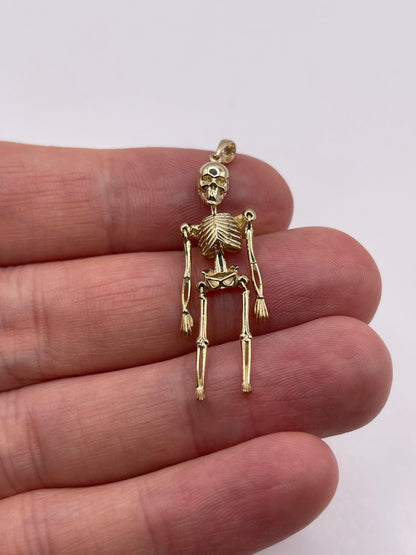9ct gold articulated skeleton pendant