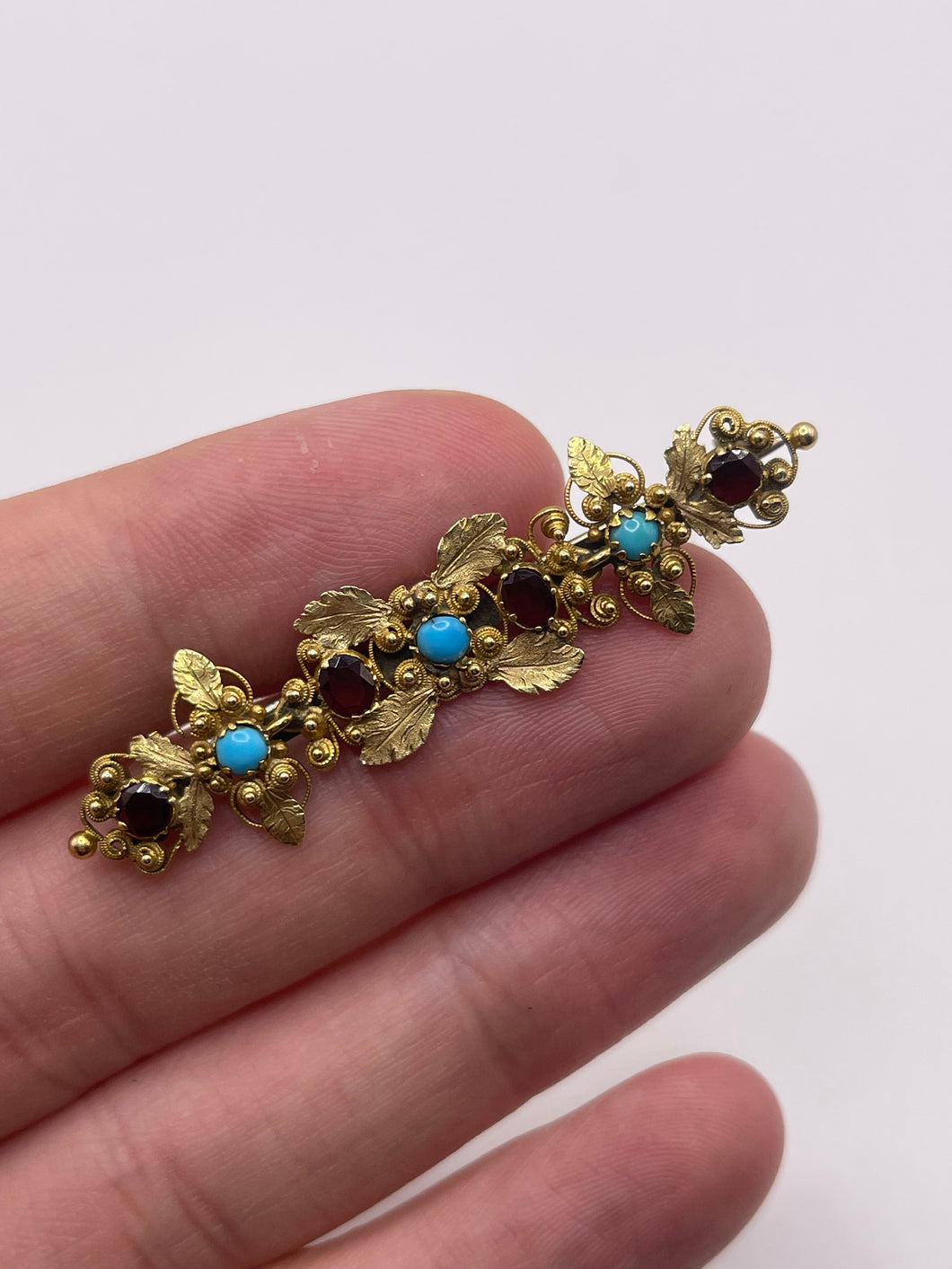 Antique high carat gold turquoise and garnet brooch