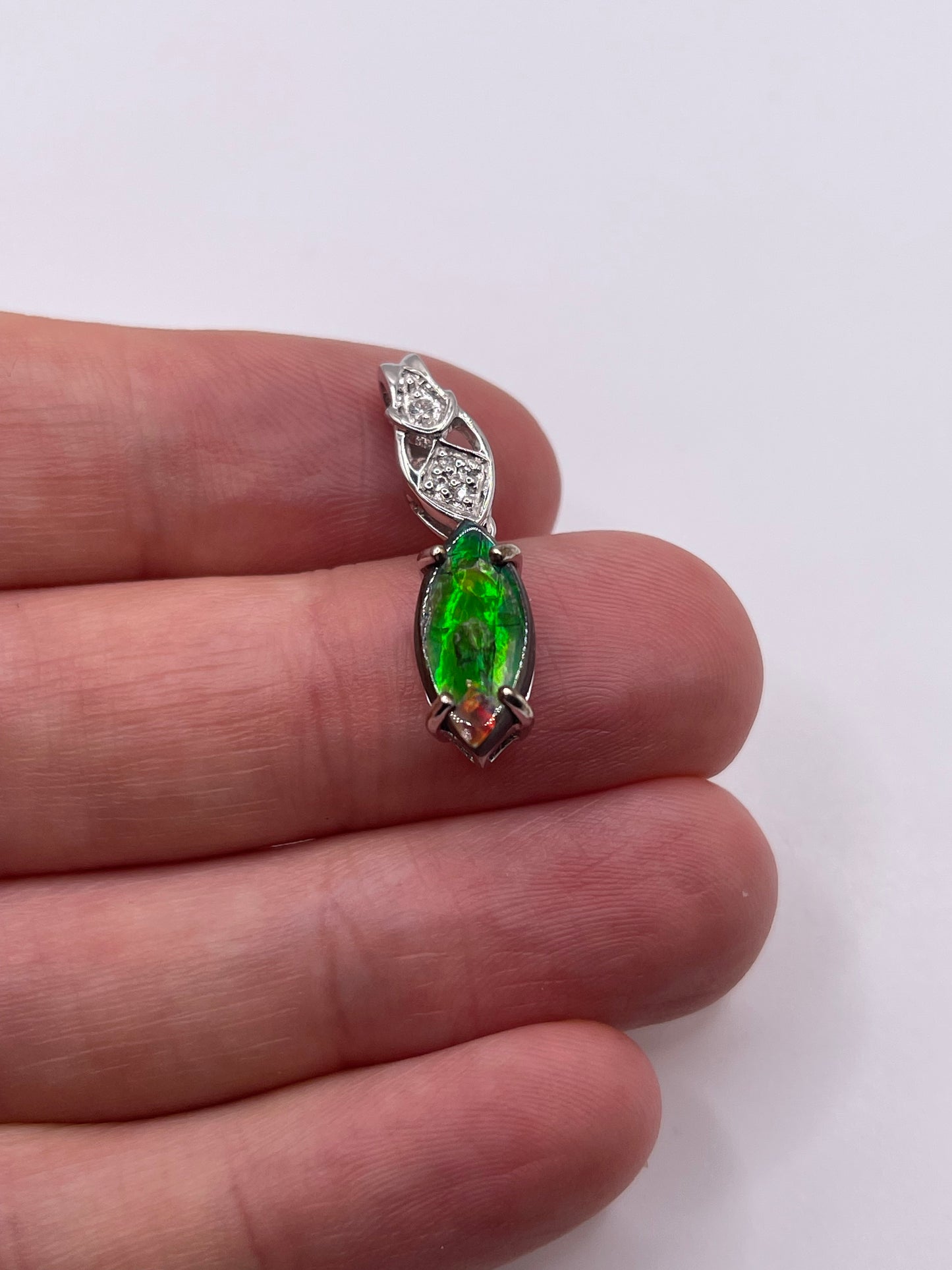 9ct white gold Ammolite and zircon pendant