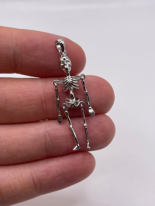 Silver articulated skeleton pendant