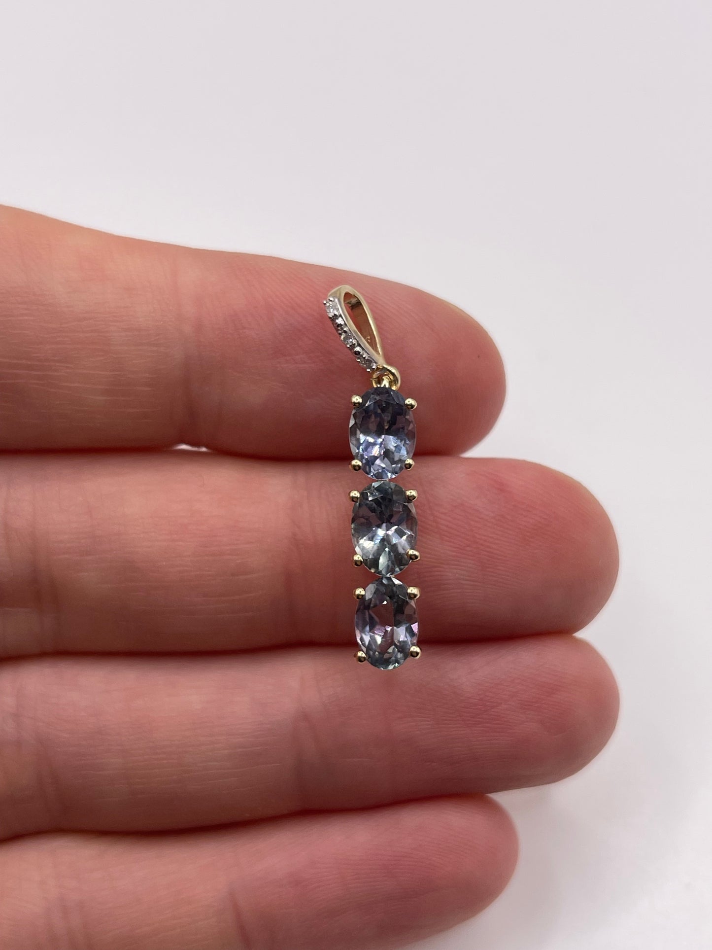 9ct gold tanzanite and diamond pendant
