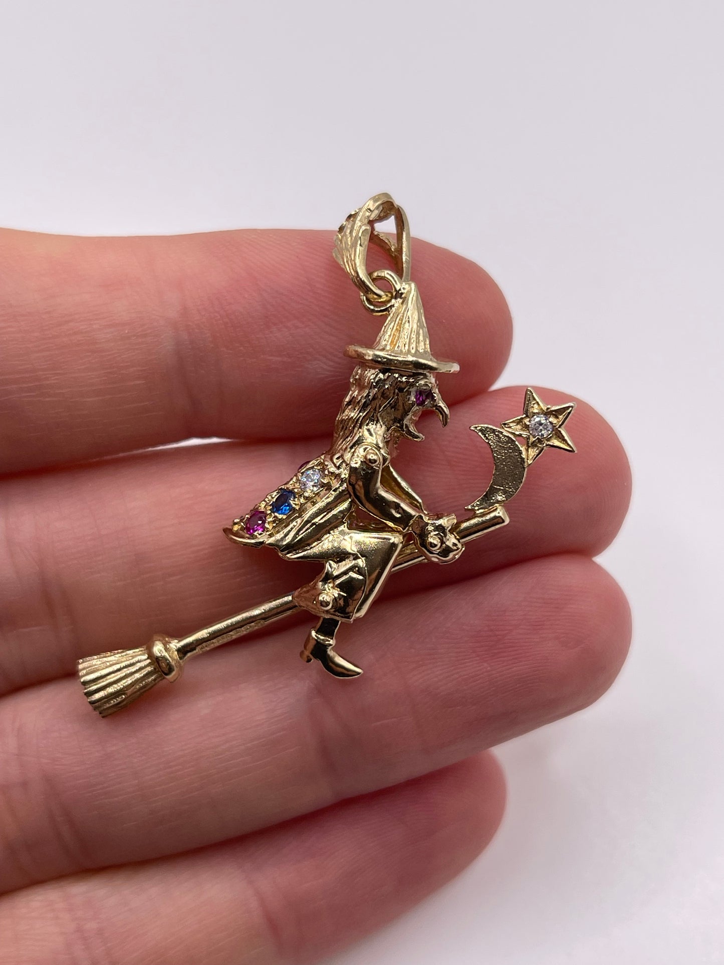 9ct gold stone set articulated witch pendant
