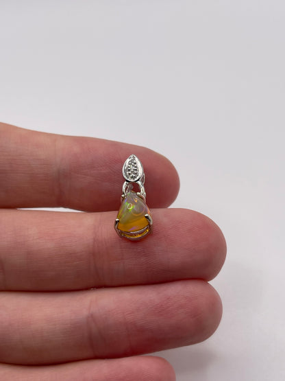 9ct white gold opal and diamond pendant